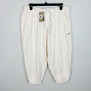 Nike Women's Therma-FIT One Loose Fleece Pants in Pale Ivory Plus Size